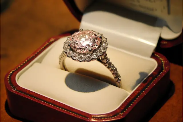 Halo style diamond engagement ring