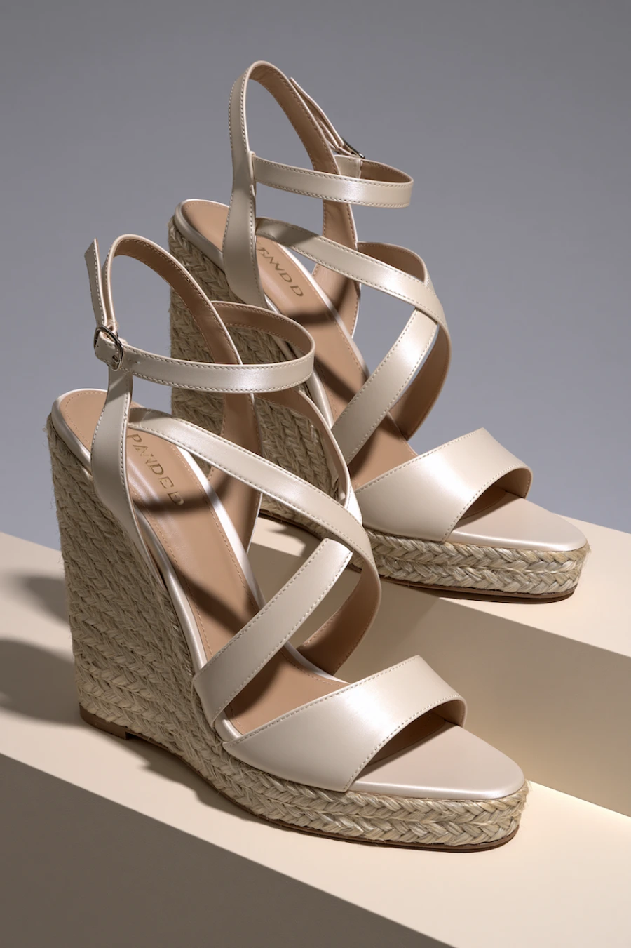 Wedding Shoes for the Bride: 27 Beautiful Ideas That Balance Style and Comfort 11 Ivory bridal wedge sandals with braided espadrille heels, crossover straps, and ankle buckles in a clean studio setting