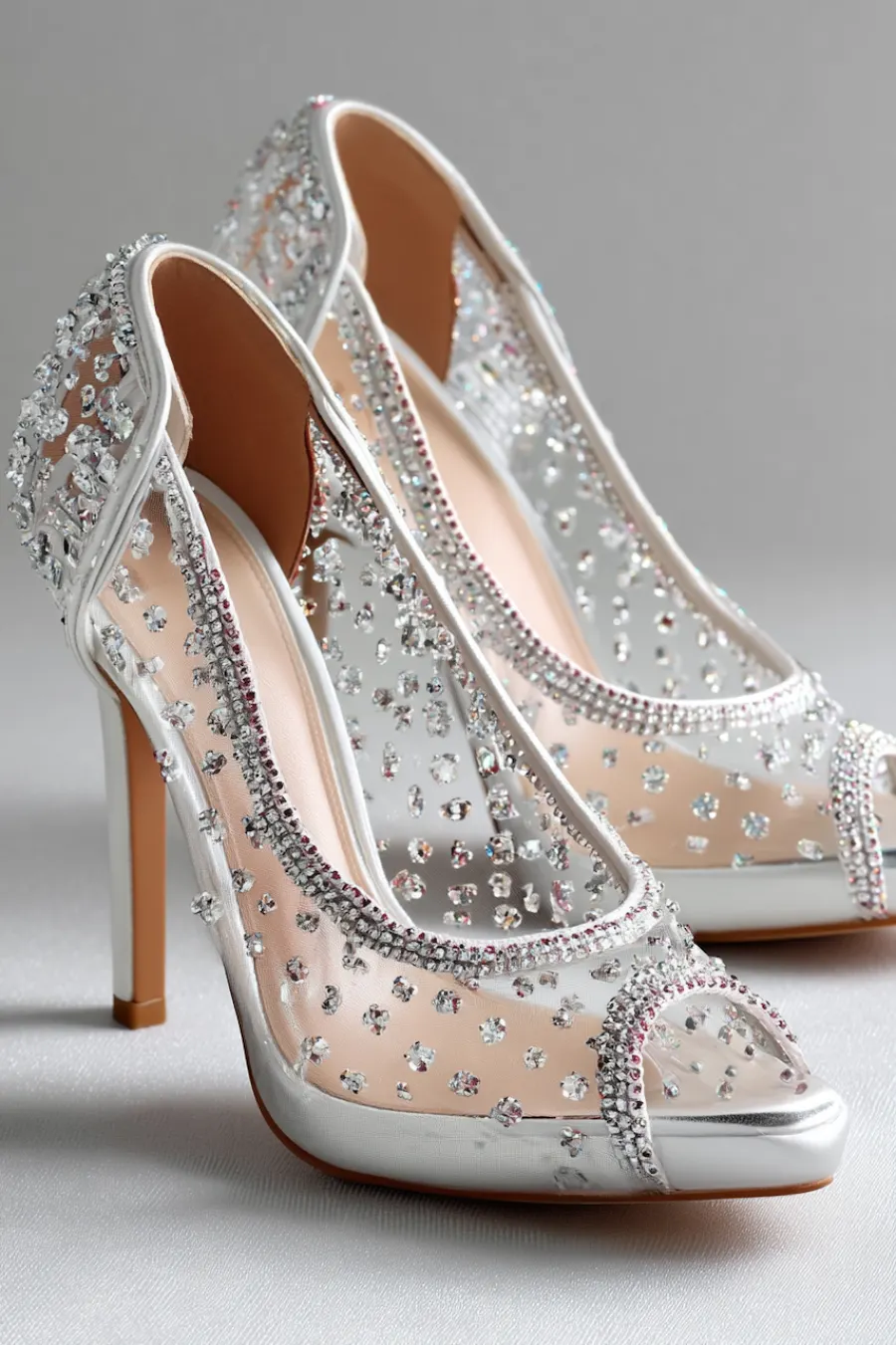Wedding Shoes for the Bride: 27 Beautiful Ideas That Balance Style and Comfort 24 Ivory crystal embellished wedding heels with sheer mesh panels, peep toes, and sparkling rhinestones for glamorous bridal style