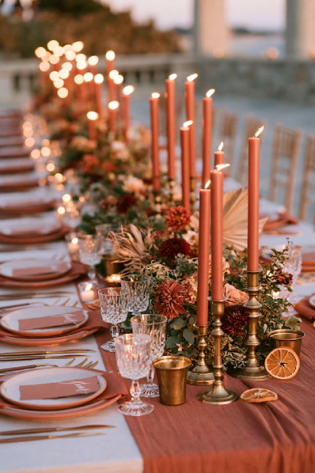 Terracotta Wedding Color Scheme: The Coziest, Most Iconic Palette Around 15 Terracotta sunset wedding tablescape with taper candles, warm florals, and romantic golden-hour reception decor